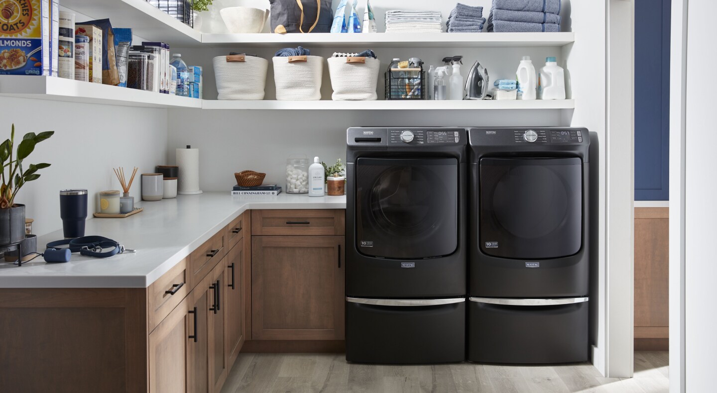 Laundry room featuring Maytag® washer and dryer. Laundry room featuring Maytag® washer and dryer.