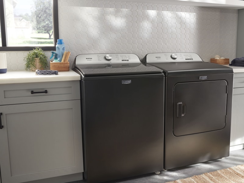 Overview of a mudroom with Maytag washer and dryer. Overview of a mudroom with Maytag washer and dryer.