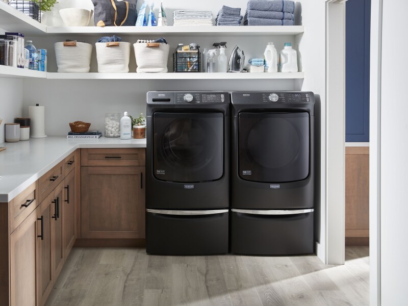 Laundry room featuring Maytag® washer and dryer. Laundry room featuring Maytag® washer and dryer.