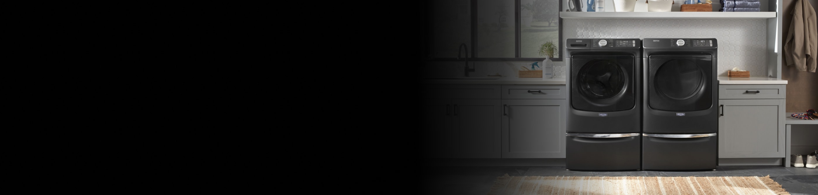 Laundry room featuring Maytag® washer and dryer