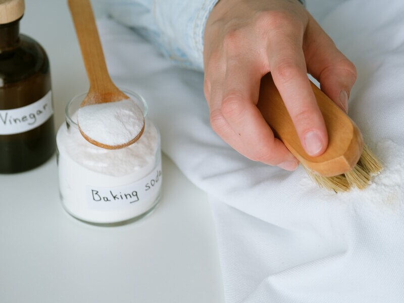 A hand scrubbing fabric with a scrub brush