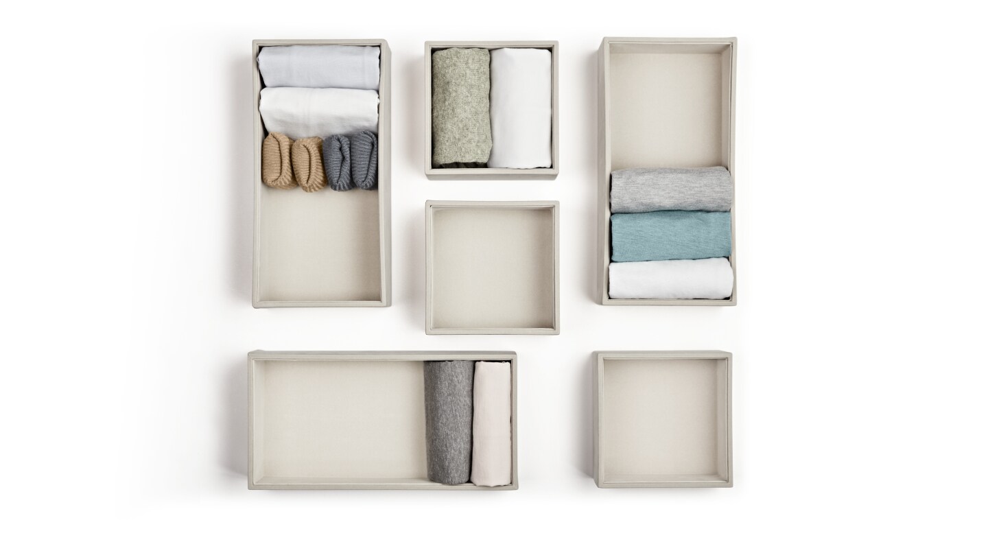 A set of folded items in boxes