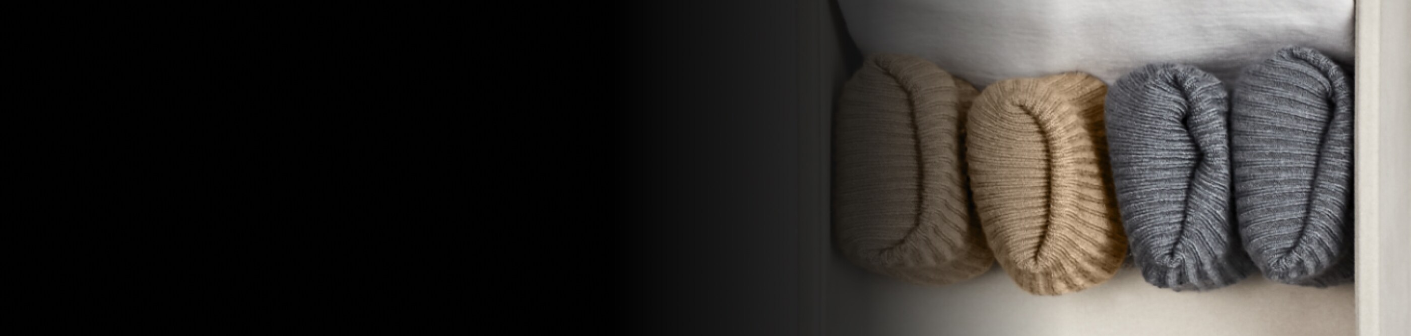 A set of folded, hand-knitted items