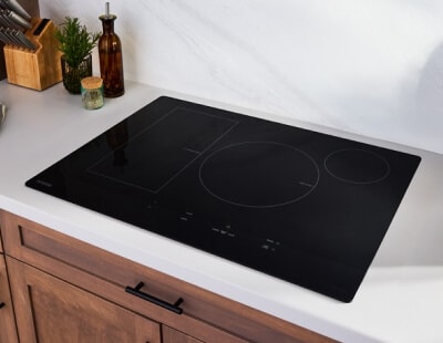 Black induction cooktop on white countertop