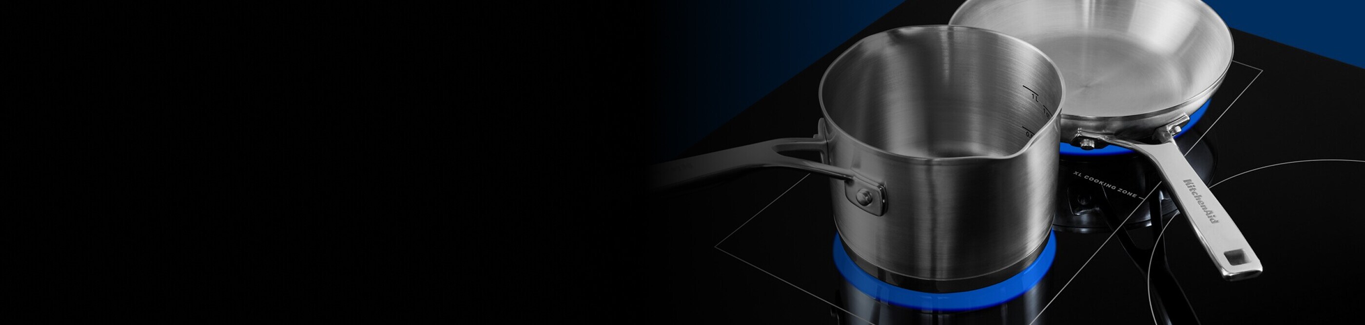 Stainless steel cookware warming on induction cooktop heating elements