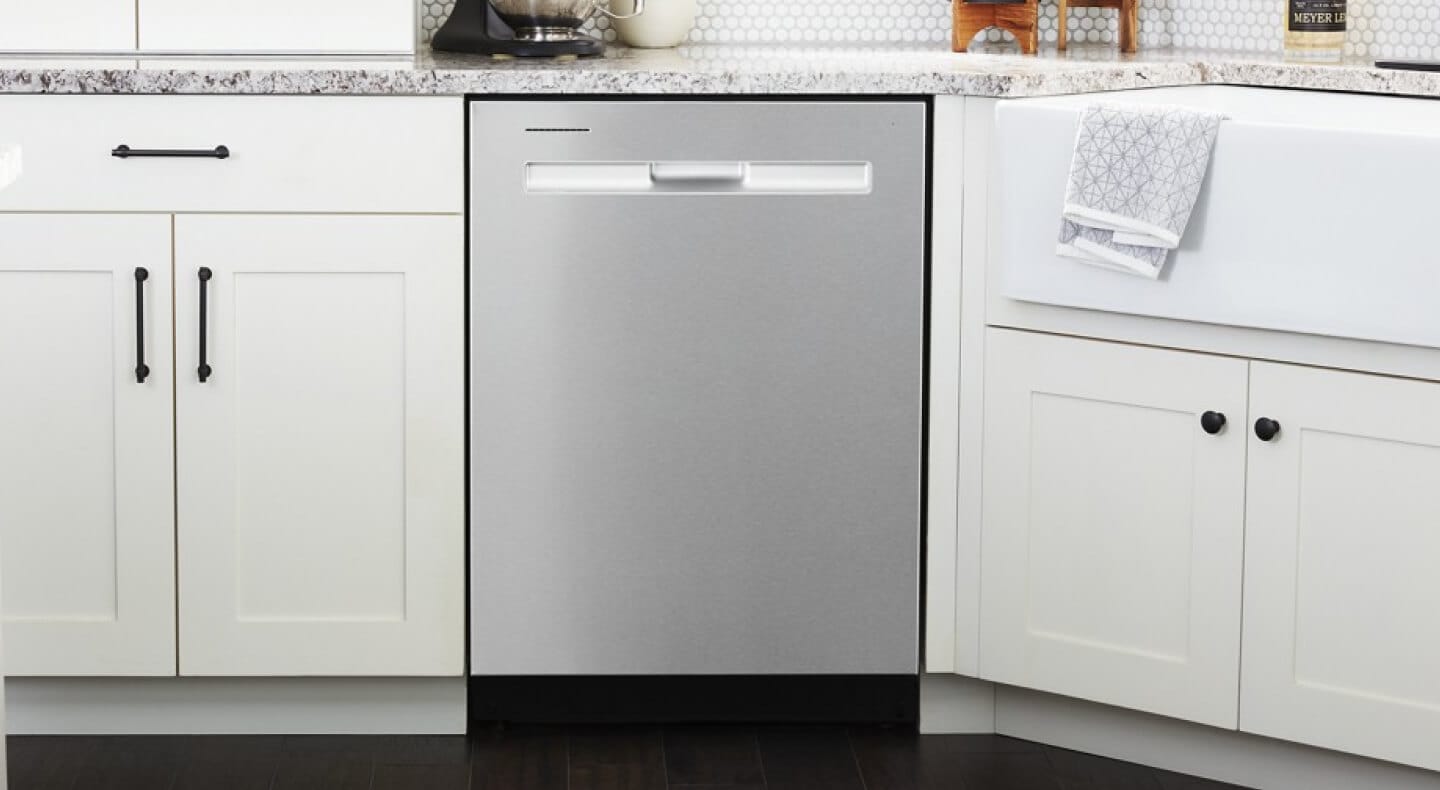 Stainless steel Maytag® dishwasher in white cabinetry