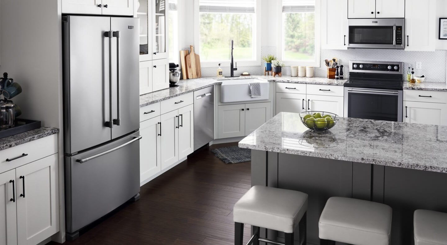 Maytag® French door refrigerator in white cabinetry