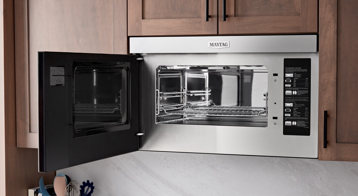 Maytag® over-the-range toaster oven combination in brown cabinetry