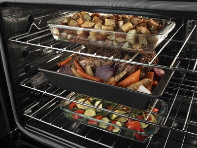 Three full casserole dishes on three separate oven racks