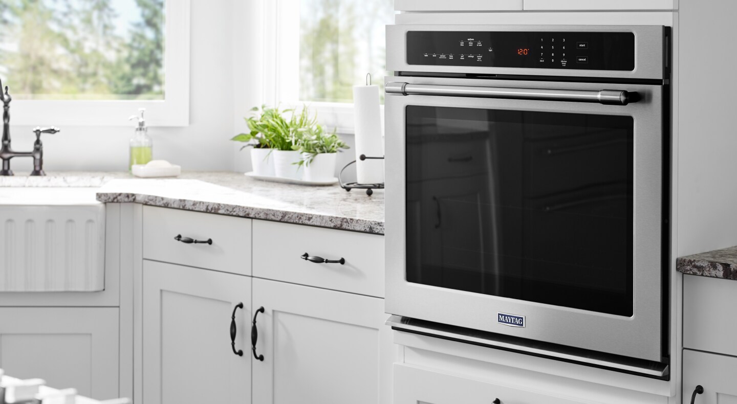 Single Maytag® wall oven installed in white cabinetry