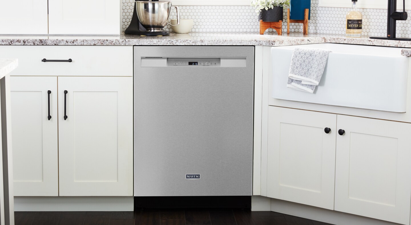 A stainless steel Maytag® dishwasher in a modern kitchen A stainless steel Maytag® dishwasher in a modern kitchen