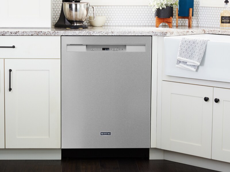 A stainless steel Maytag® dishwasher in a modern kitchen A stainless steel Maytag® dishwasher in a modern kitchen