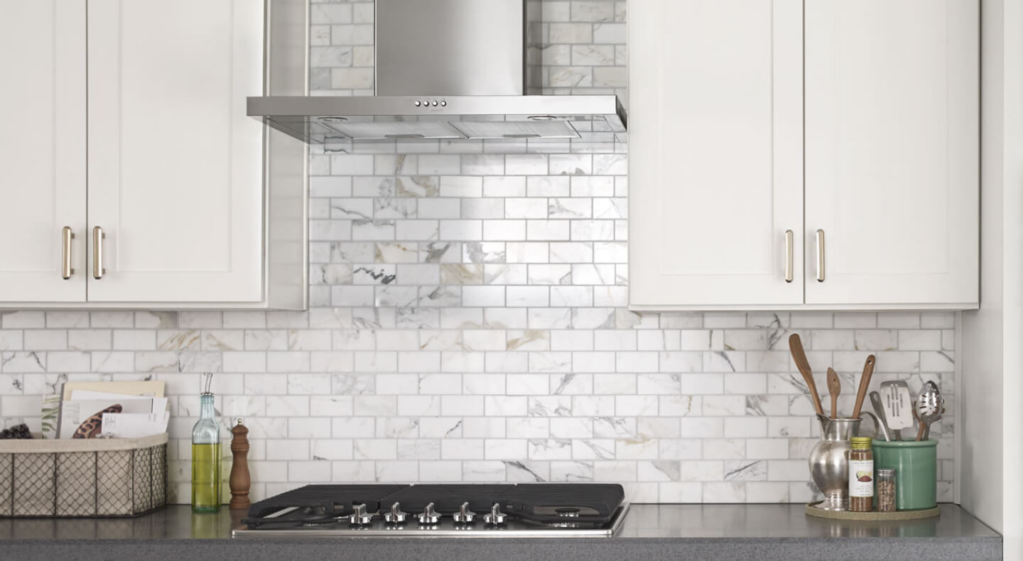 Range hood over cooktop in a modern kitchen