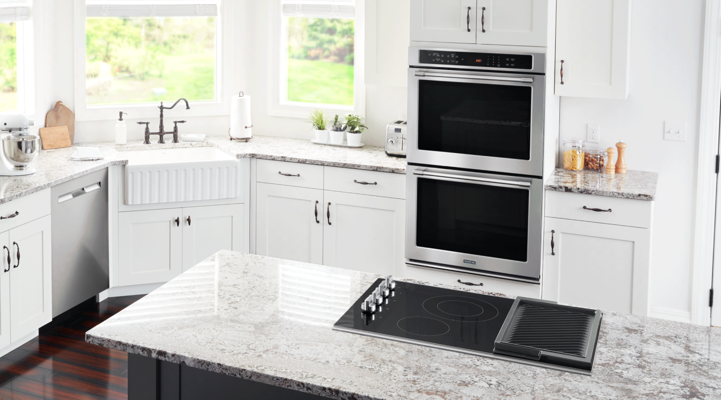 Double wall oven with cooktop on an island