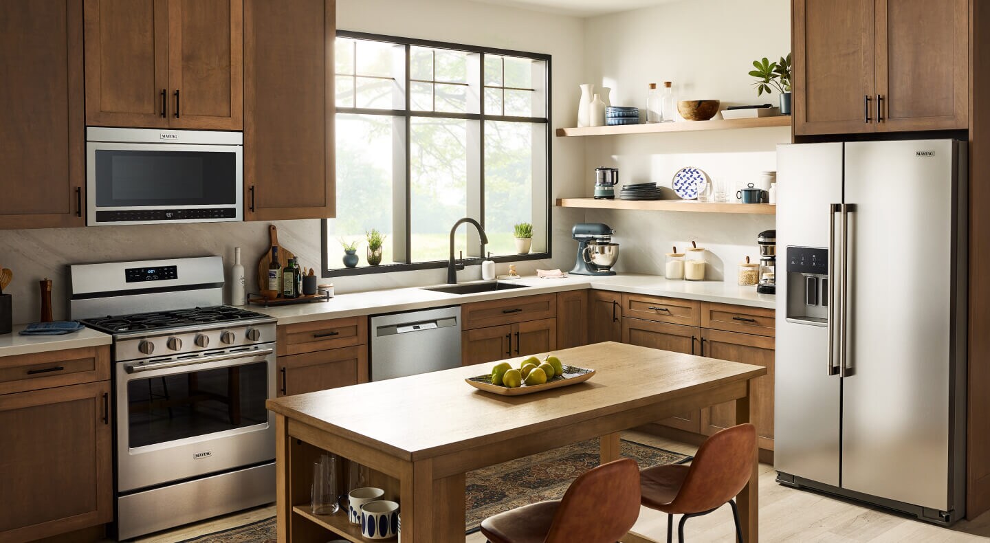A kitchen with stainless steel Maytag® appliances