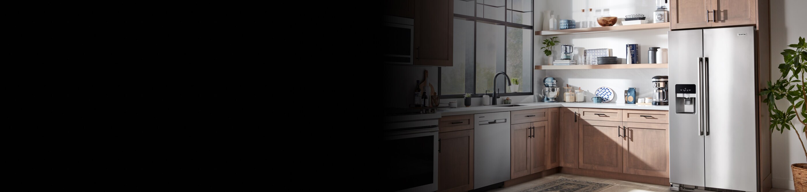 A kitchen with stainless steel Maytag® appliances