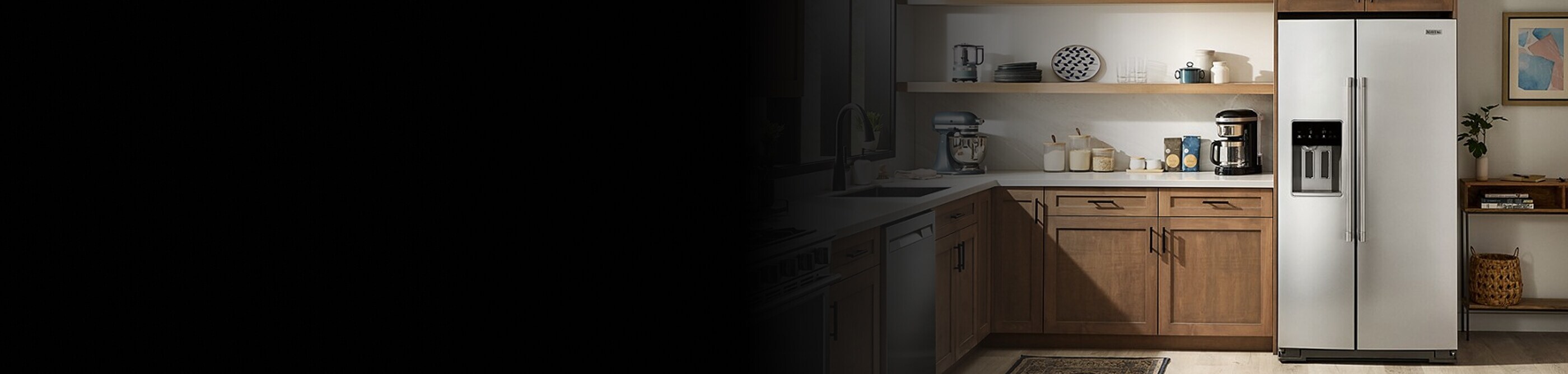 A kitchen with a stainless steel side-by-side refrigerator