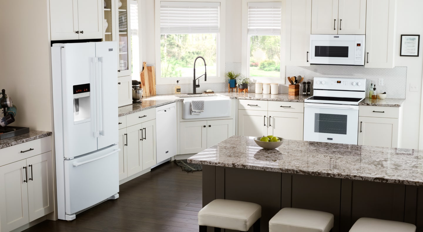 White appliances in a kitchen setting with white cabinets White appliances in a kitchen setting with white cabinets
