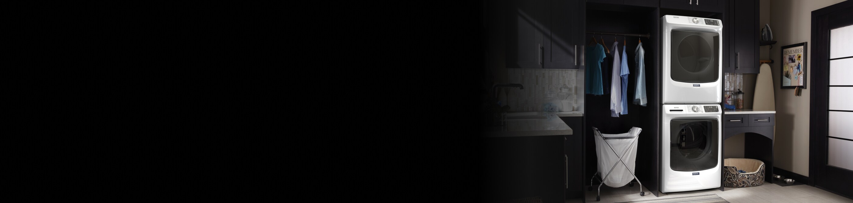 Maytag® stacked washer and dryer in a laundry room