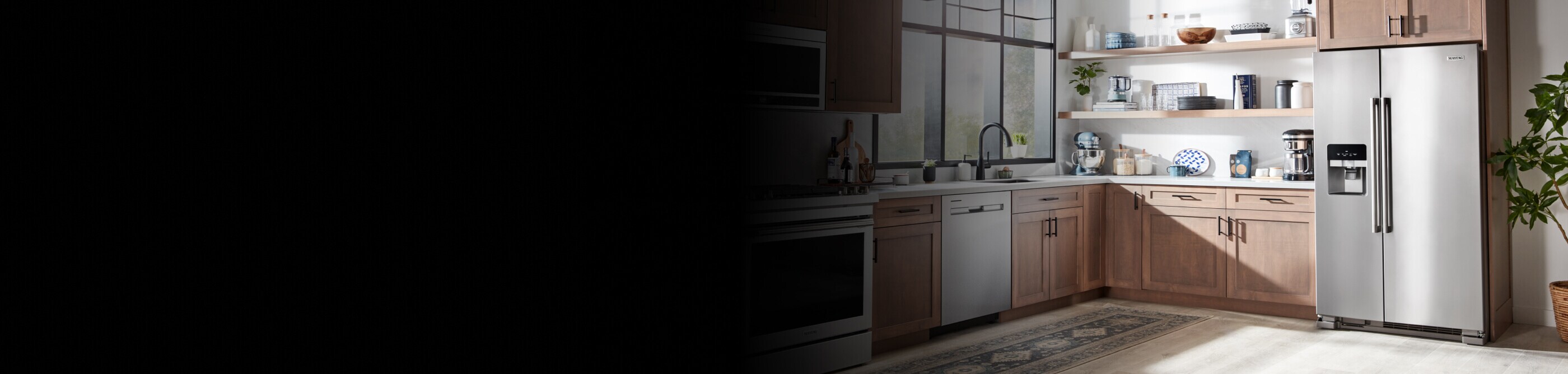 Maytag® appliances set in light brown cabinetry