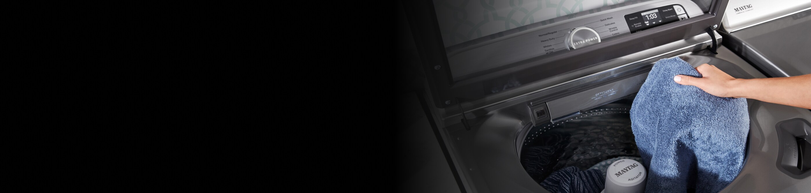 Maytag® top load washing machine filled with laundry