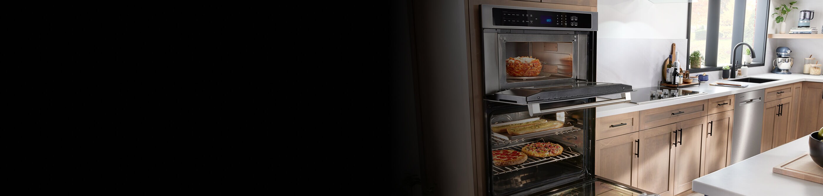 Wall oven open to show cooked food inside