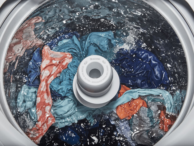 Clothes agitating inside of a top load washer with an agitator