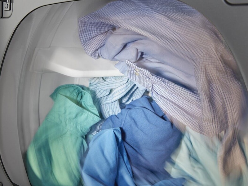 Button-up shirts tumbling inside a dryer