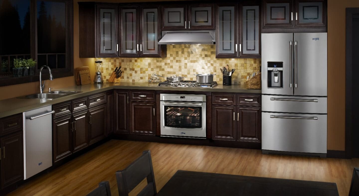 A modern kitchen fully equipped with stainless steel Maytag® appliances