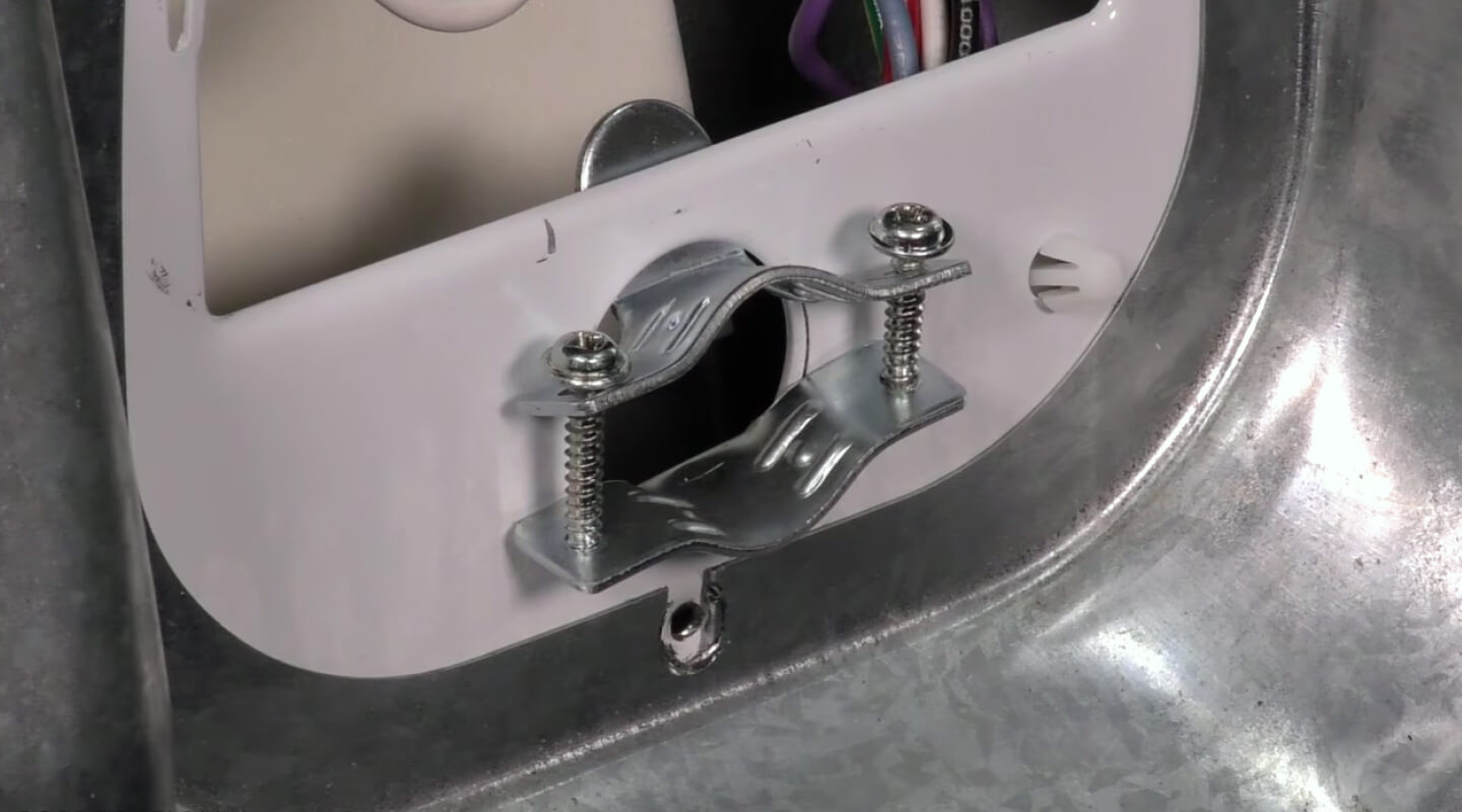 Bracket and screws from the back of a dryer Bracket and screws from the back of a dryer