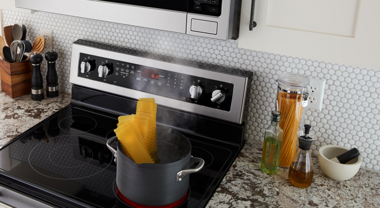 Lasagna noodles boiling on a stovetop