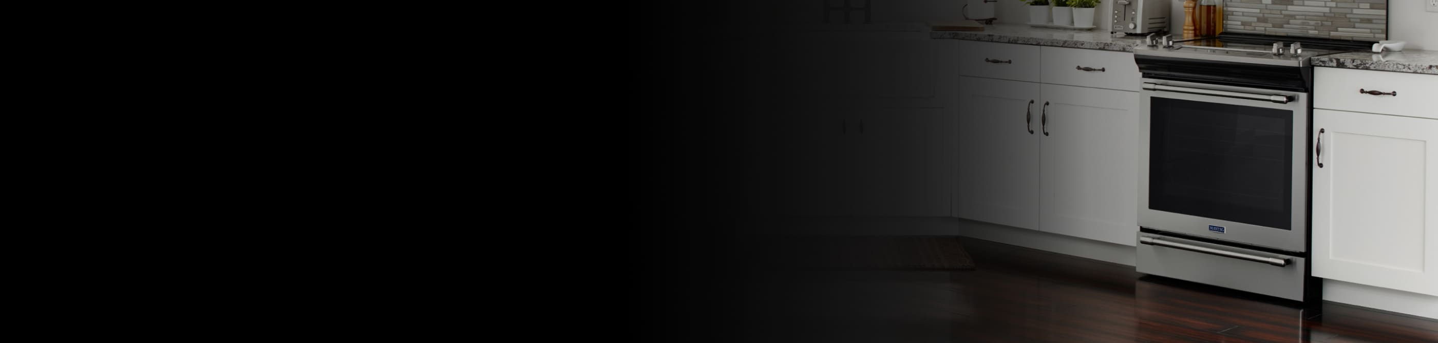 Slide-in range in a white kitchen