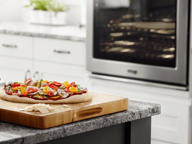 A homemade pizza on a countertop