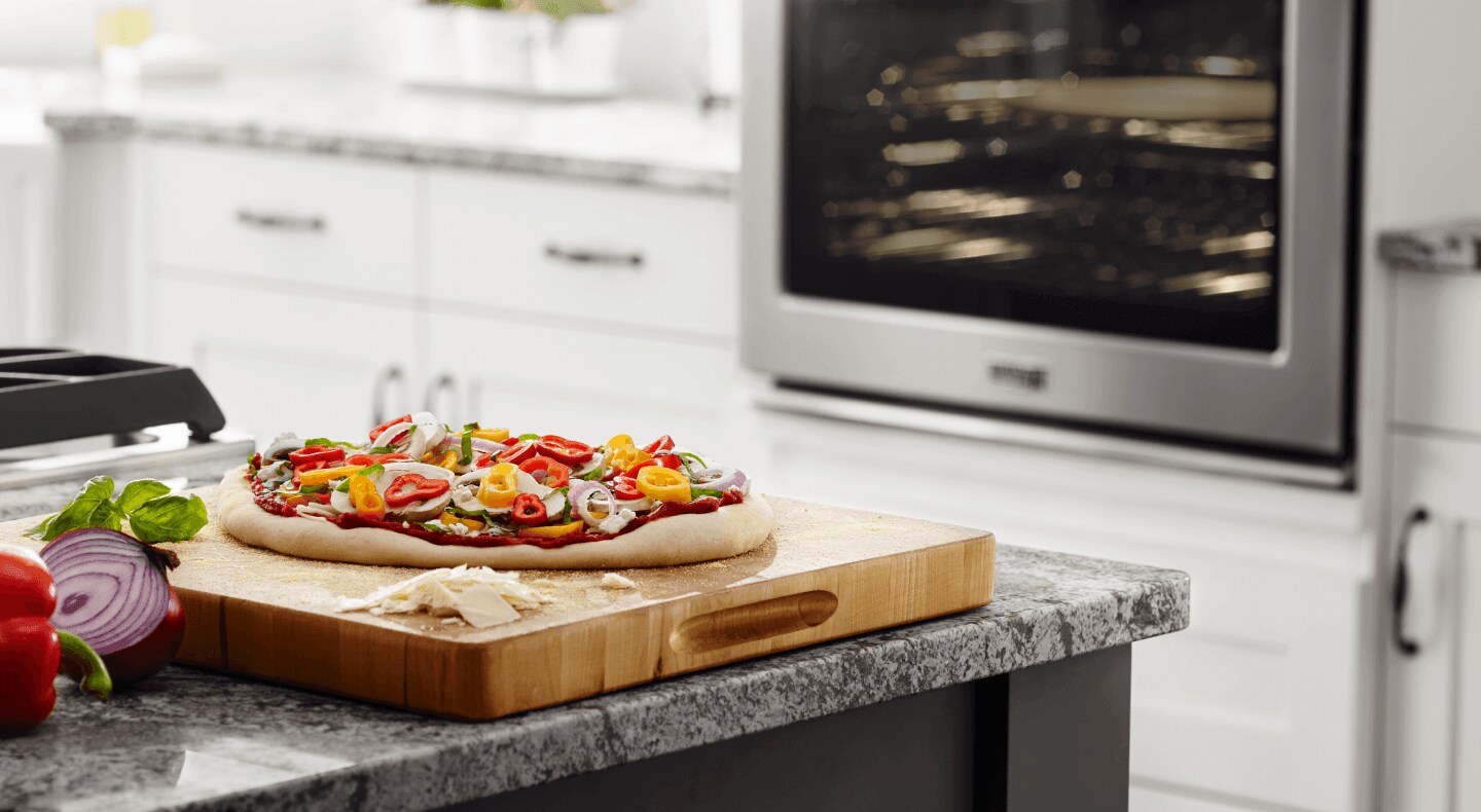 A homemade pizza on a countertop