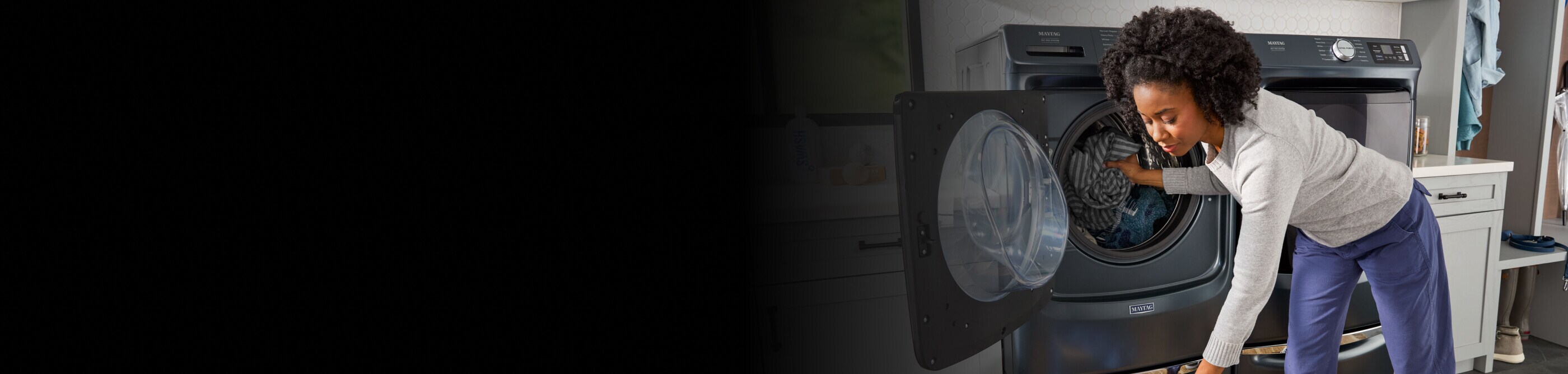 Person loading laundry into a Maytag® washer