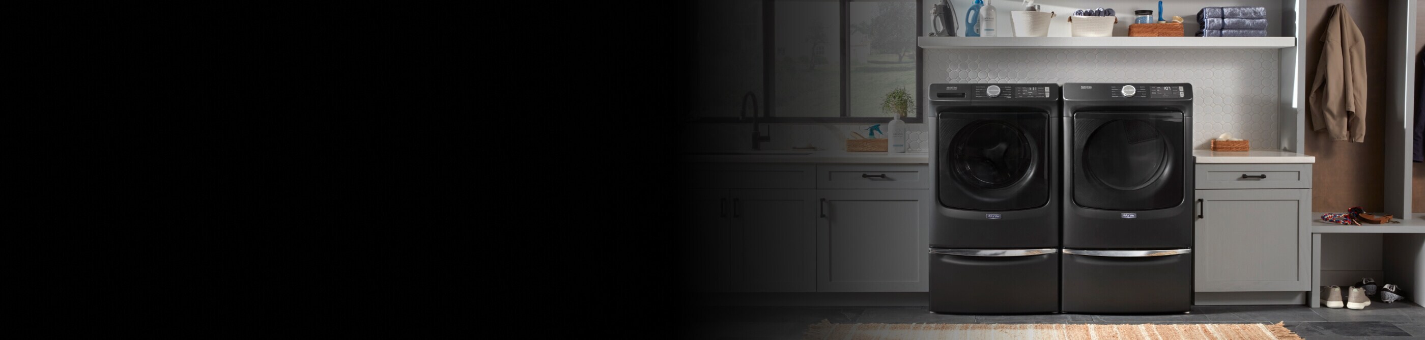 Maytag® front load washer and dryer side-by-side in a laundry room