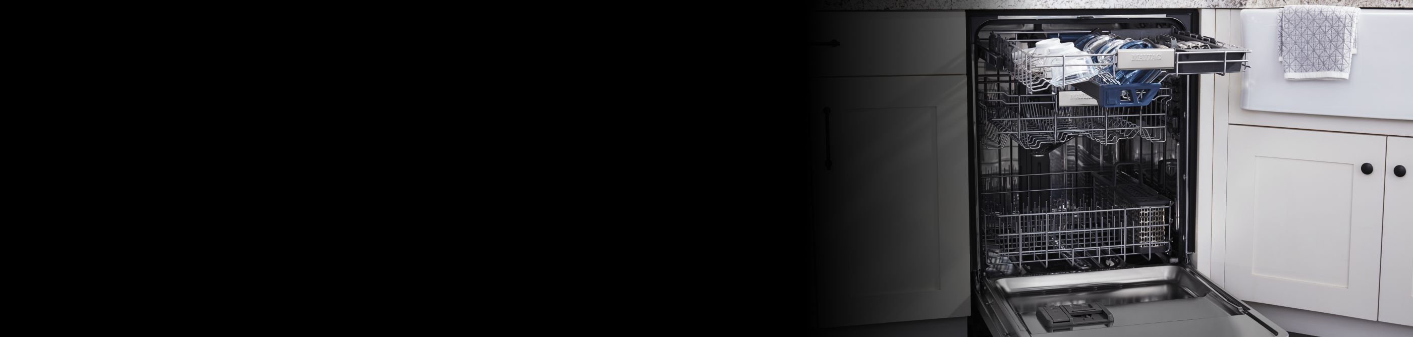 Open Maytag® dishwasher with bowls on top rack