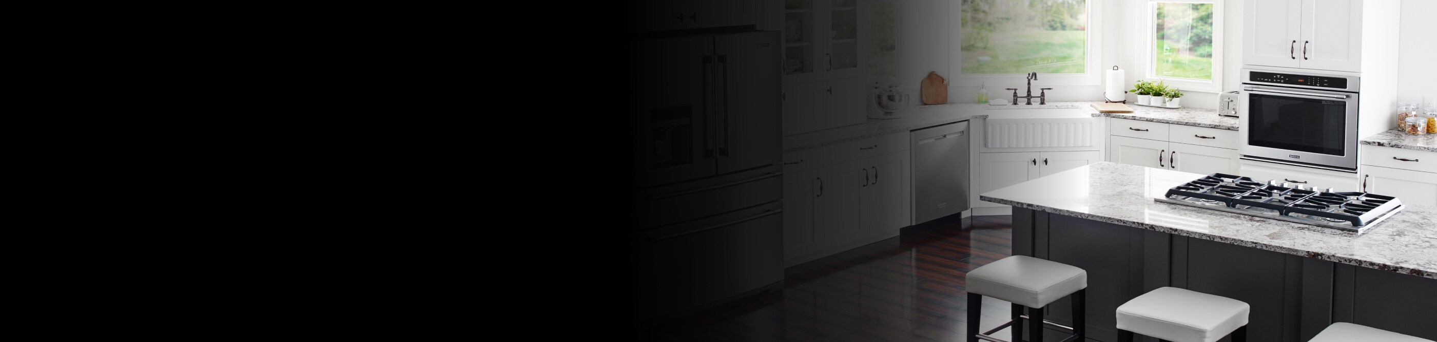 Open kitchen with gas stovetop on center granite countertop island