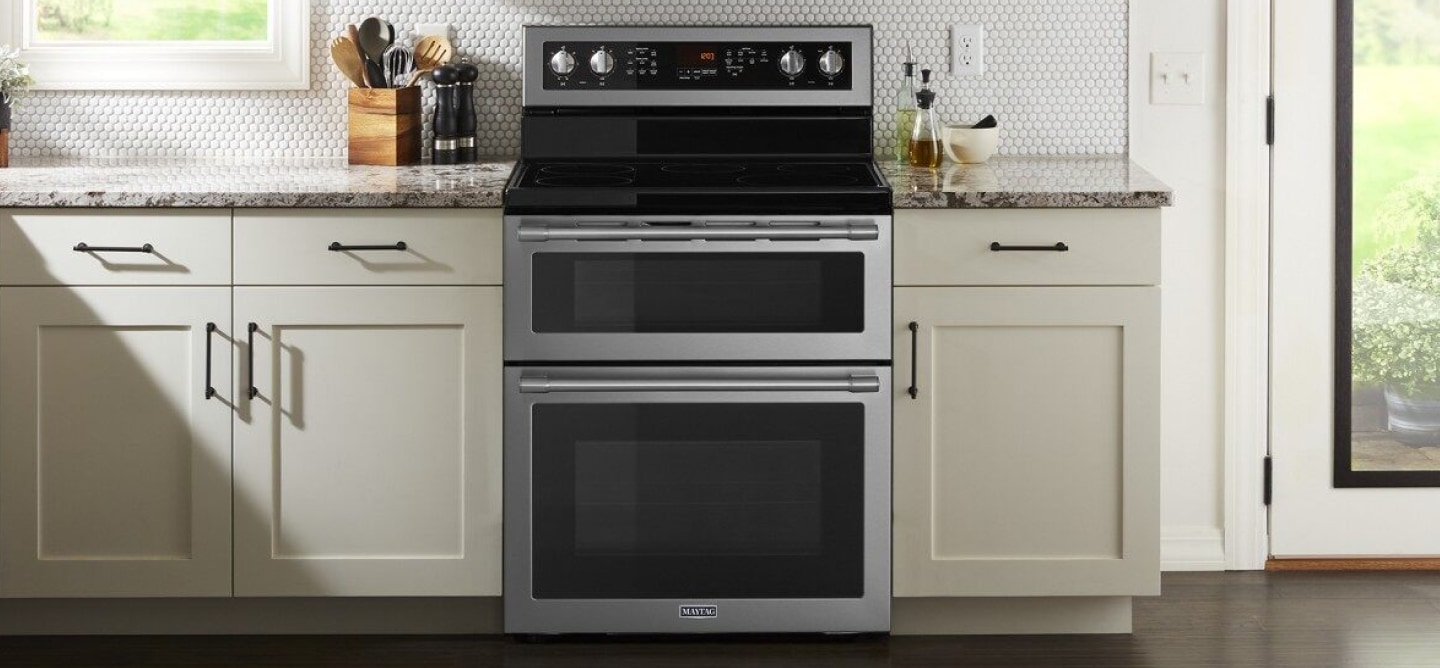 Double electric range in a white kitchen Double electric range in a white kitchen