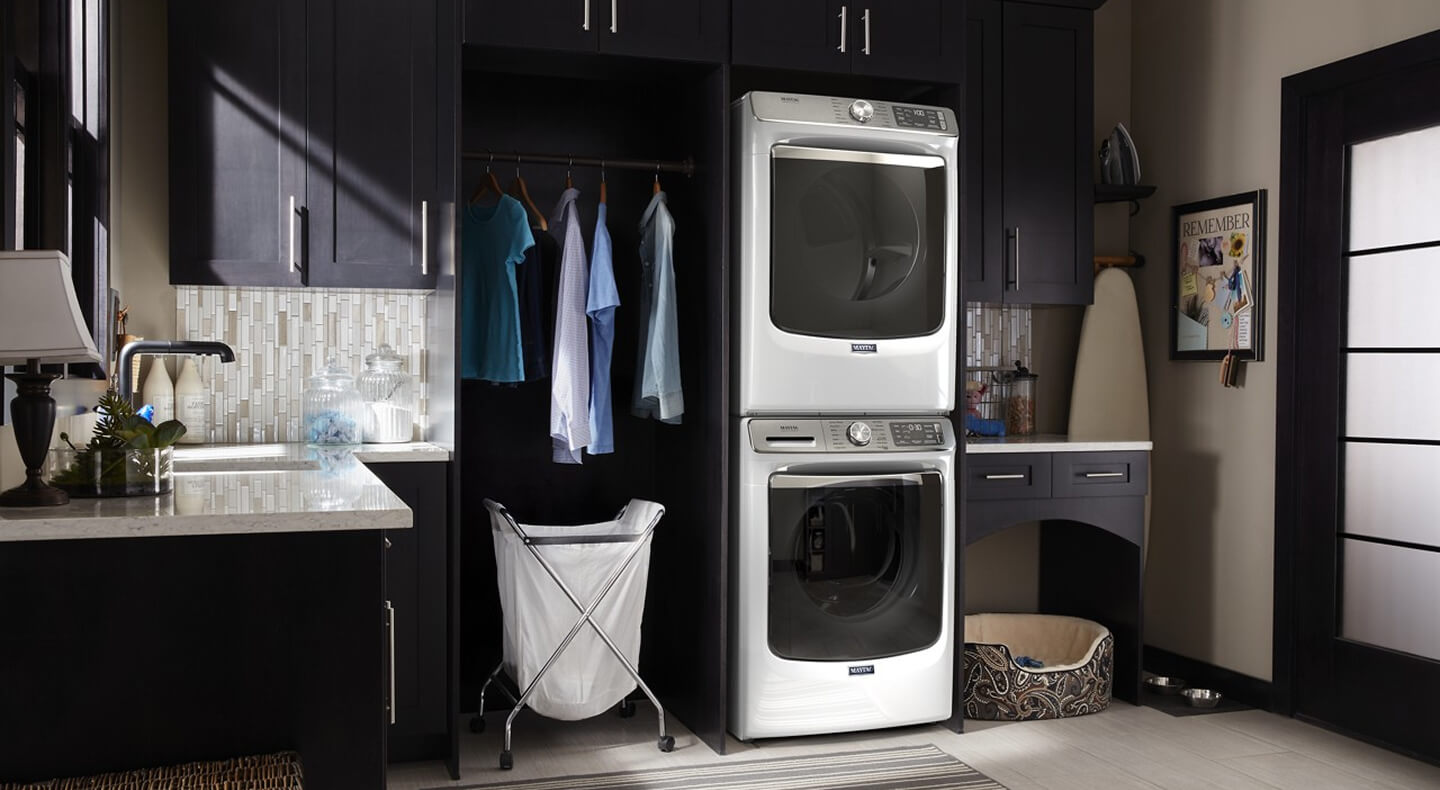Stackable washer and dryer in laundry room