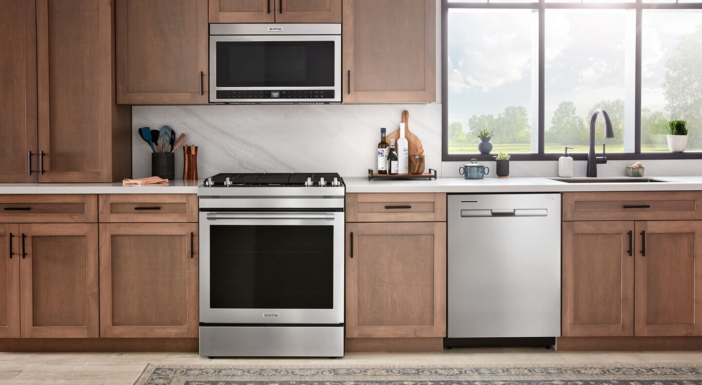 Maytag® over-the-range microwave above a Maytag® gas range