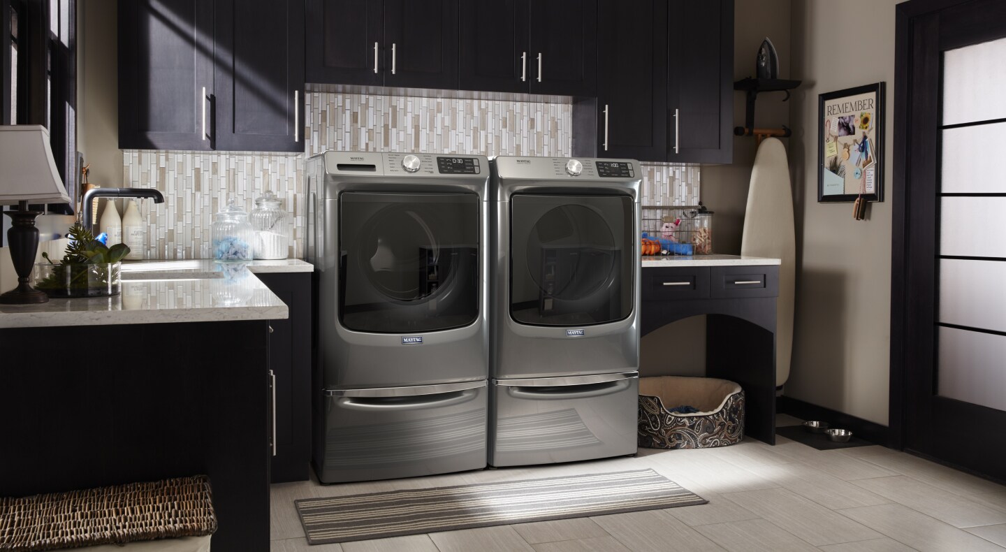 A laundry room featuring a Maytag® dryer.