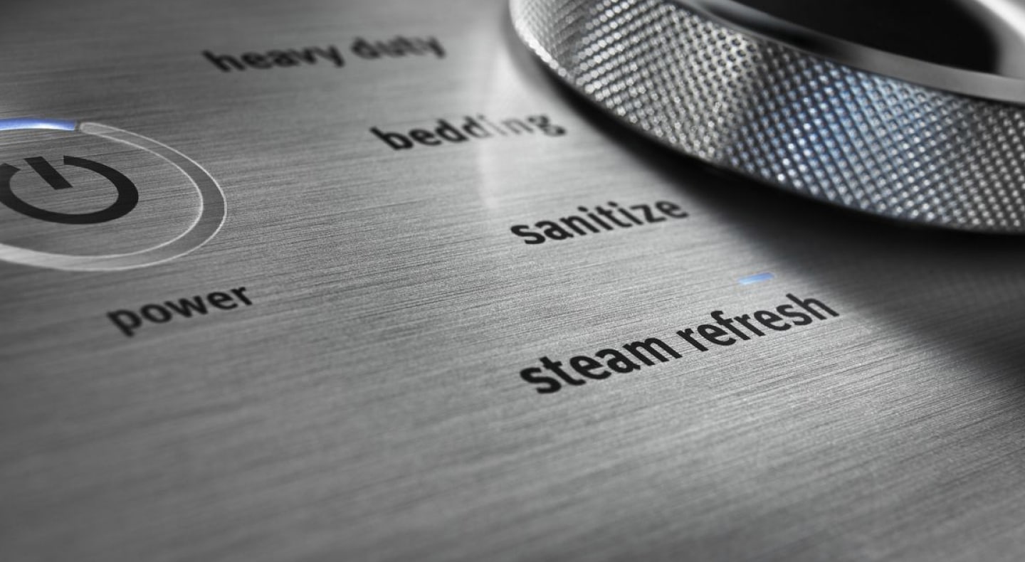 A close-up of a dryer control dial with cycle options. A close-up of a dryer control dial with cycle options.