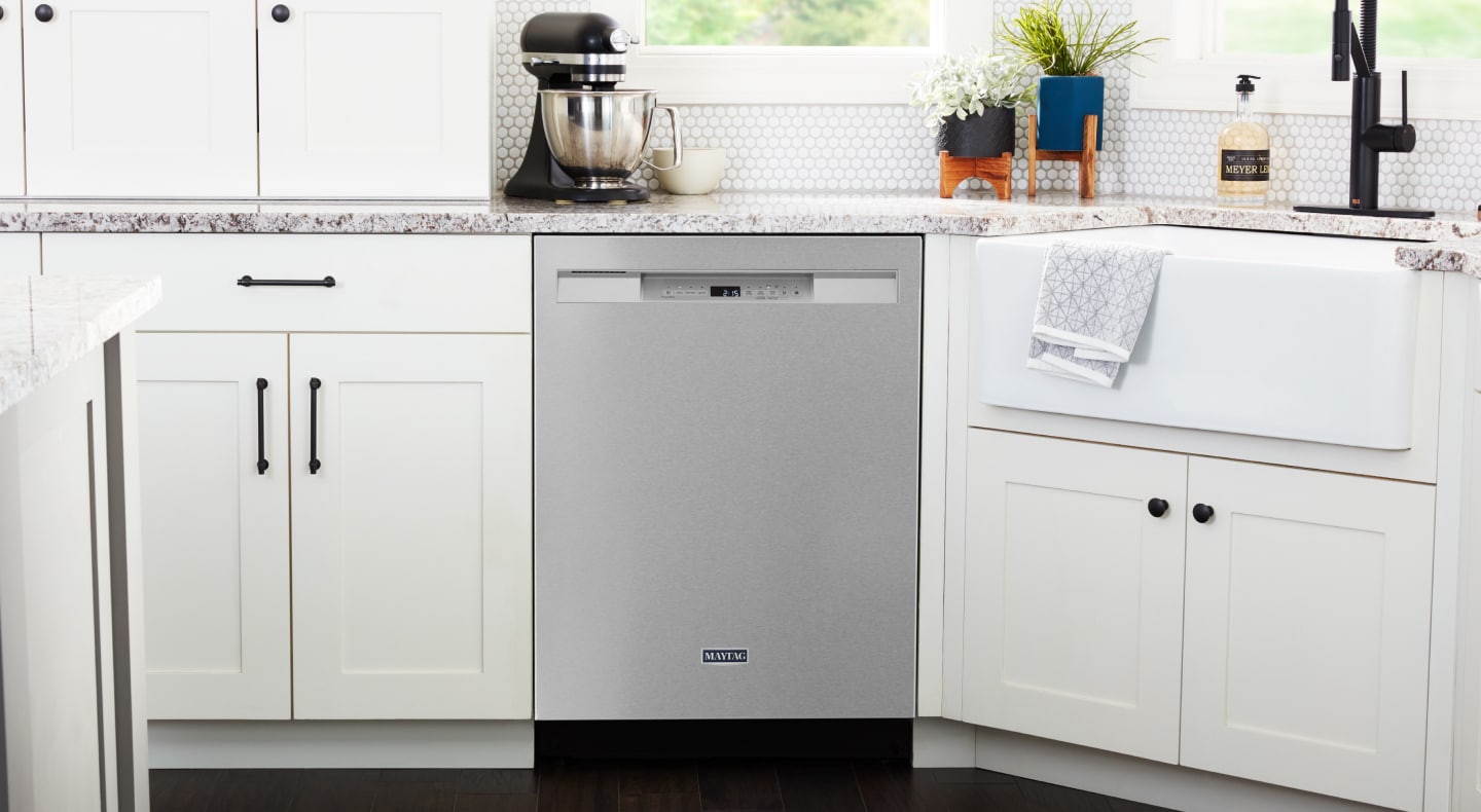 A Maytag® dishwasher in a modern kitchen. A Maytag® dishwasher in a modern kitchen.