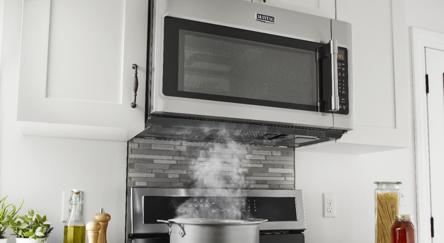Maytag® over-the-range microwave in a modern kitchen