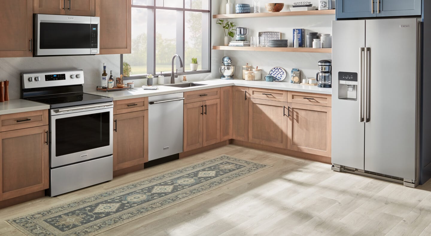 Kitchen with wood cabinets in a work triangle layout