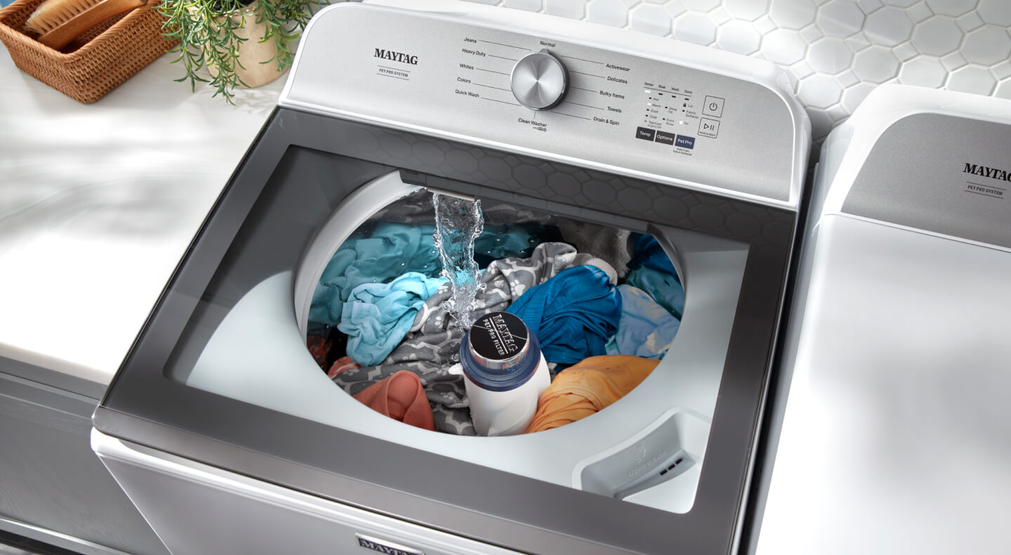 Maytag® Pet Pro Top Load Washer with clothes washing inside