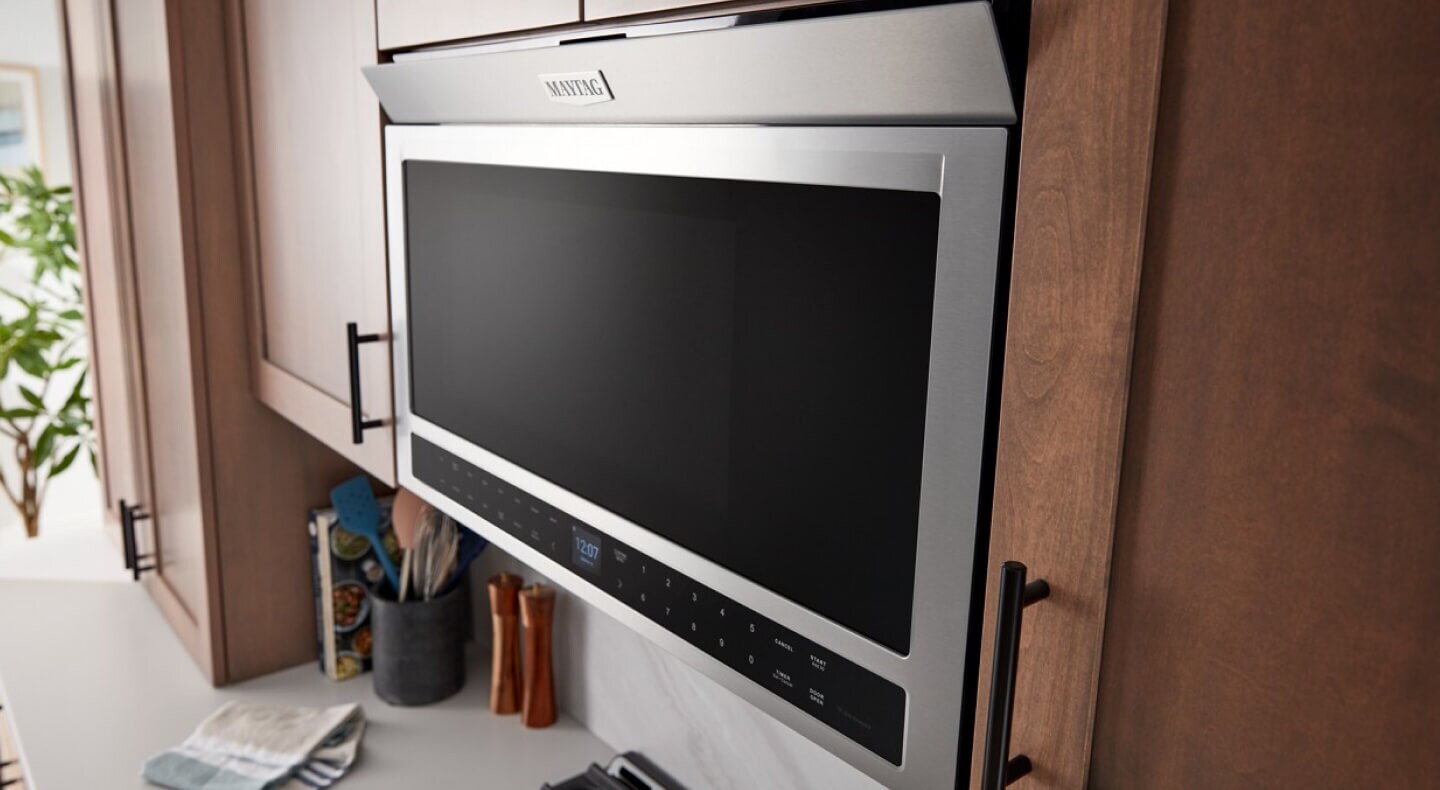 Maytag® microwave sitting flush against cabinets