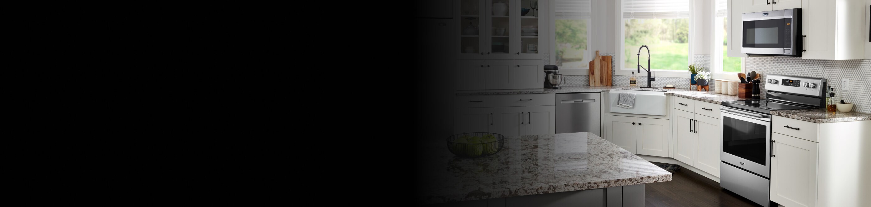 Maytag® appliances in a kitchen with white cabinets