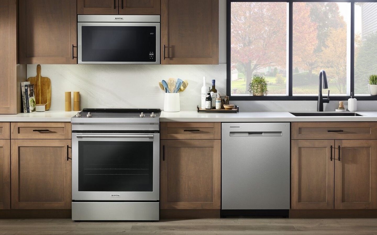 Modern-style kitchen featuring a Maytag® stove and microwave